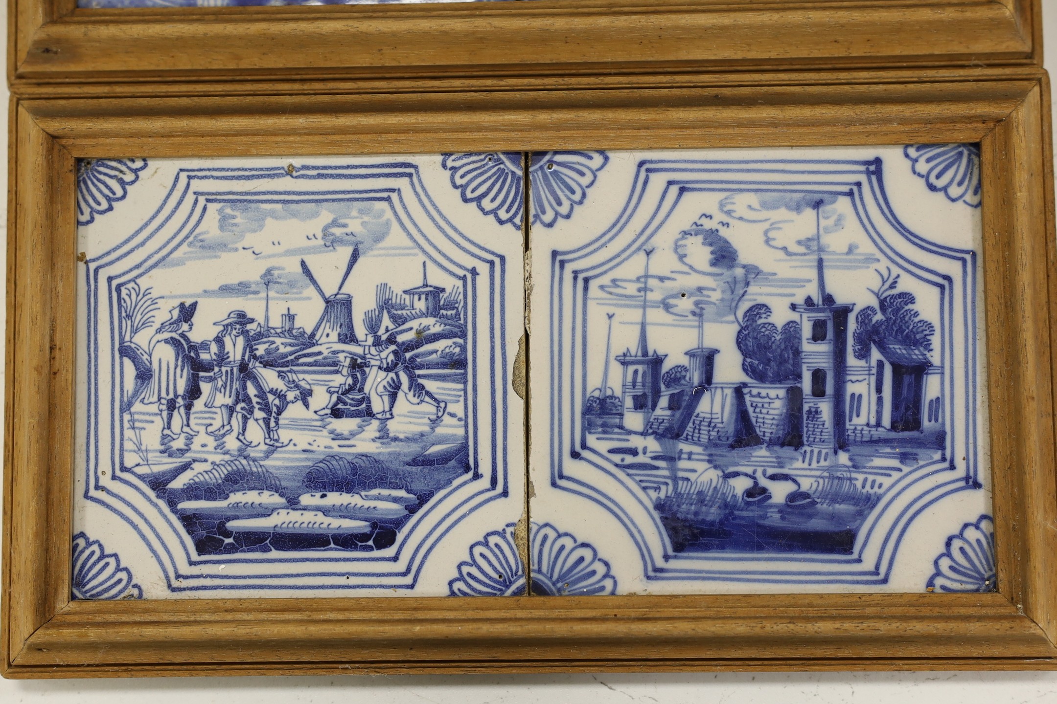 Three pairs of Delft blue and white ‘landscape’ tiles, 18th/19th century, in double frames